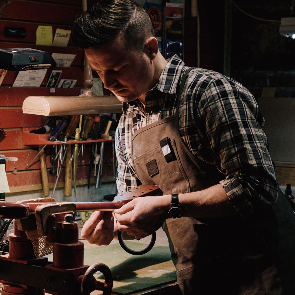 Filson Tin Cloth Apron Dark Tan, paired here with an iconic Filson Alaskan Guide Shirt