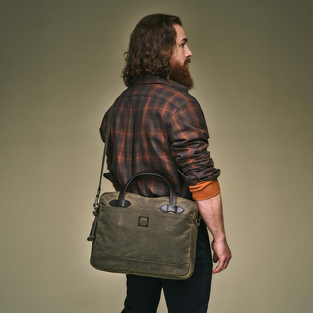 Filson Tin Cloth Compact Briefcase Otter Green, a streamlined briefcase made with heritage materials and modern design