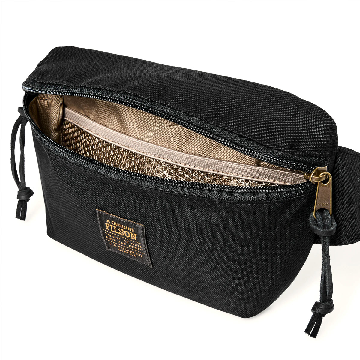 Filson Surveyor Crossbody Pack Black, lined interior with lightweight ripstop nylon and features a mesh devider